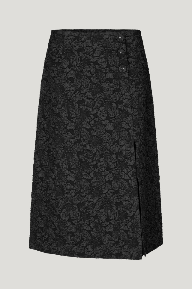 Sayona Skirt Black This midi-length, A-line jacquard skirt feature a zip closure at the side, button details at the side waist, and a deep slit at the front side - front image