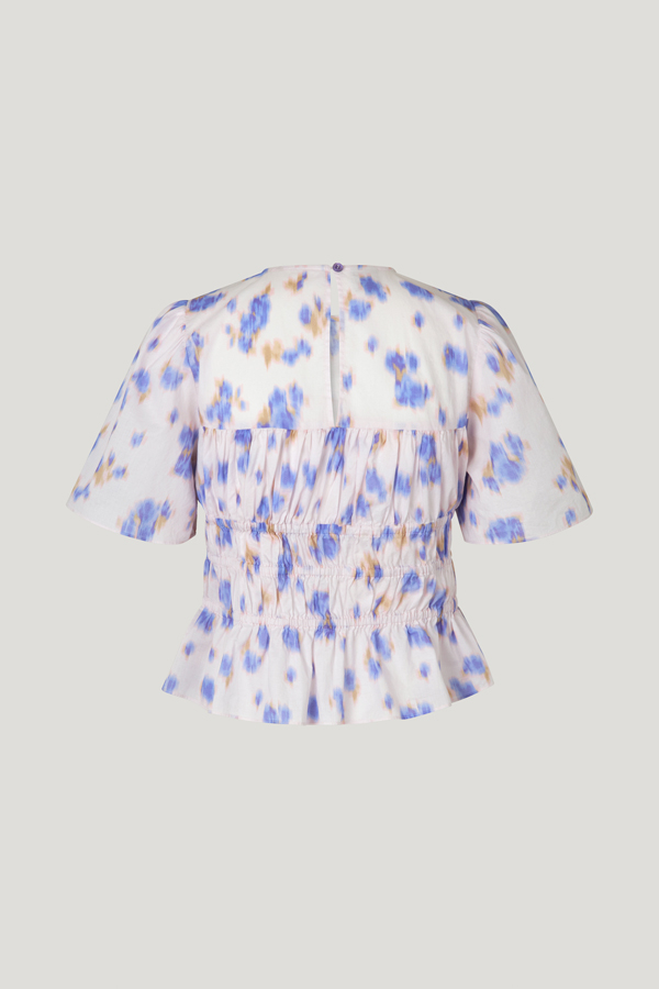 Marissa Top Purple Fleur Fanee This short sleeved top features elasticated panels throughout the body and a flare at the hem for a flattering silhouette - back image