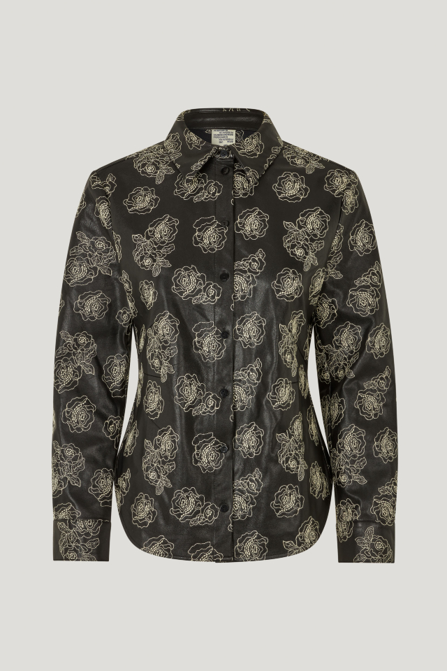 Manu Shirt Black Stitch Flower This structured button up shirt features a curved hem, embroidered pattern throughout, and buttons at the cuffs - front image