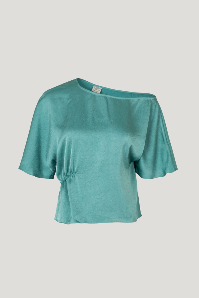 Margeaux Blouse Trellis This fluid top features an asymmetrical neckline, flutter sleeves, and ruching to one side for a flattering drape - front image