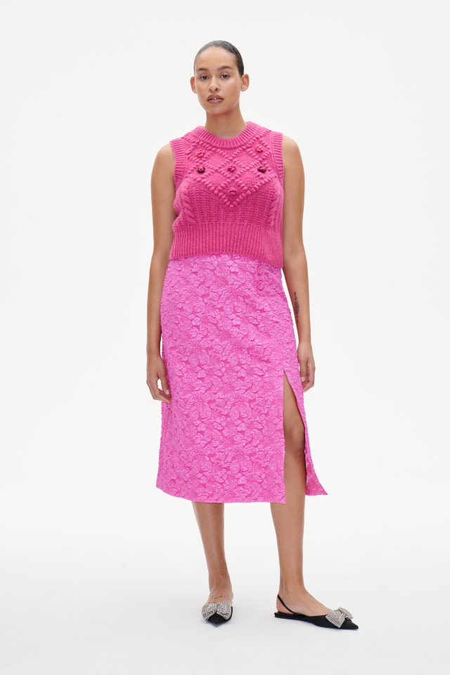 Sayona Skirt Rose Violet This midi-length, A-line jacquard skirt feature a zip closure at the side, button details at the side waist, and a deep slit at the front side - model image