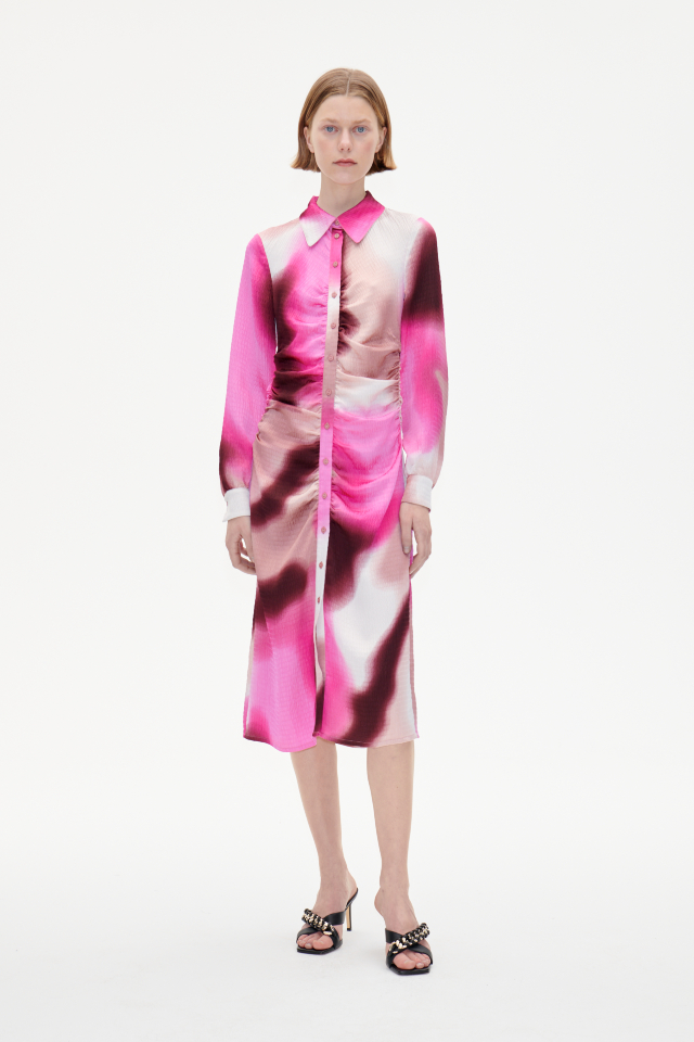 Abira Dress Pink Fade This midi-length shirt dress features button closures in the front, buttoned cuffs, and ruching at the sides for a flattering drape - model image